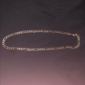 10 Karat gold figaro chain.